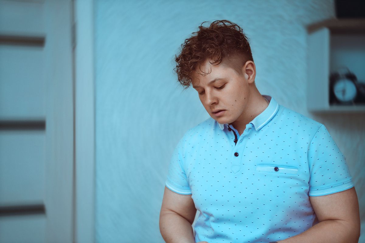 Man wearing a blue polo shirt